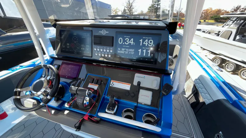Slide: The Image of 2021 Fountain 34 SC boat dashboard with advanced navigation and control systems. - 6