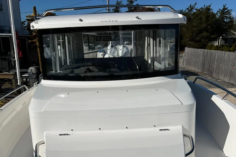 Slide: The Image of 2024 Nimbus C9 boat with sleek design and spacious cabin. - 11
