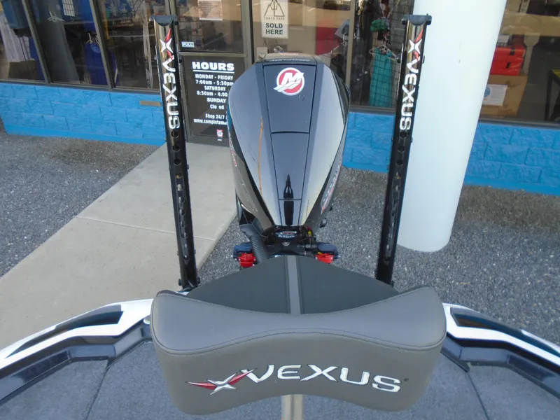 Slide: The Image of 2022 Vexus VX21 boat with powerful engine and branded seating, displayed outdoors. - 11