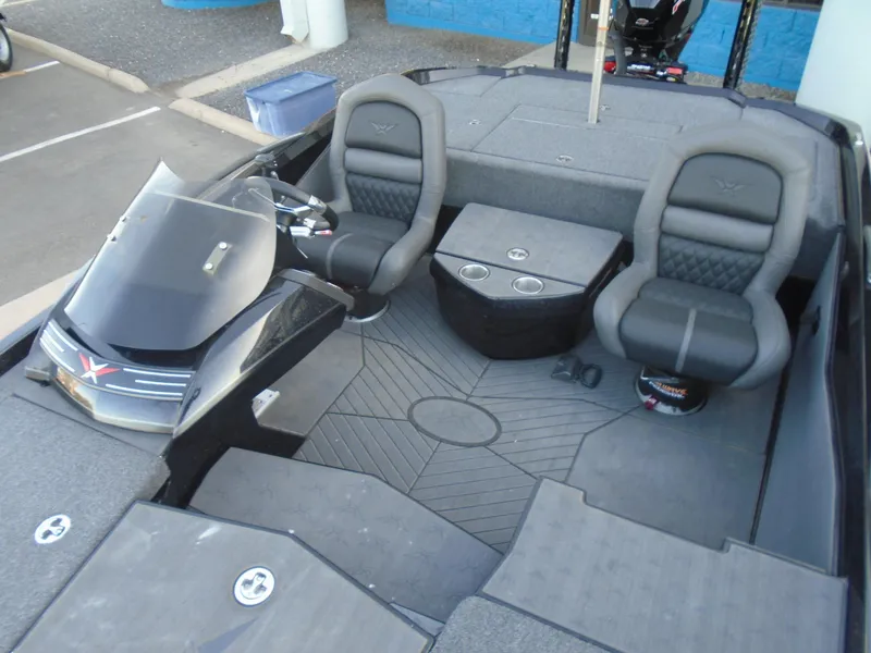 Slide: The Image of 2022 Vexus VX21 boat interior with dual seats and console. - 13
