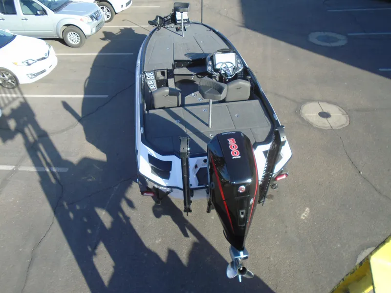 Slide: The Image of 2022 Vexus VX21 boat with motor, parked in a lot, aerial view. - 3