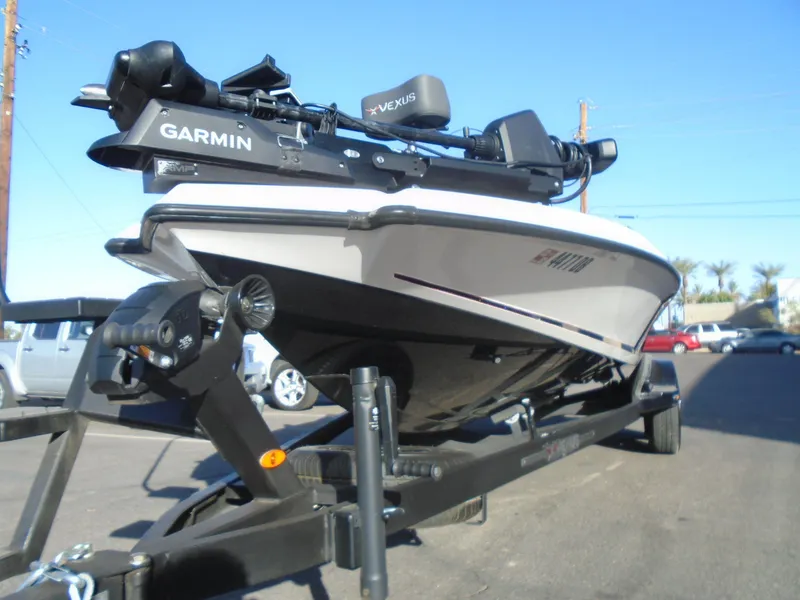 Slide: The Image of 2022 Vexus VX21 boat on trailer with Garmin equipment, parked outdoors. - 5
