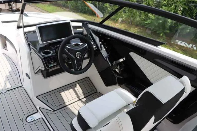 Slide: The Image of 2024 Yamaha Boats 252SD cockpit with modern steering and dashboard design. - 3