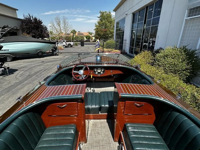 Slide: The Image of 1994 Hacker-Craft 26' Runabout with classic wooden interior and sleek design. - 8