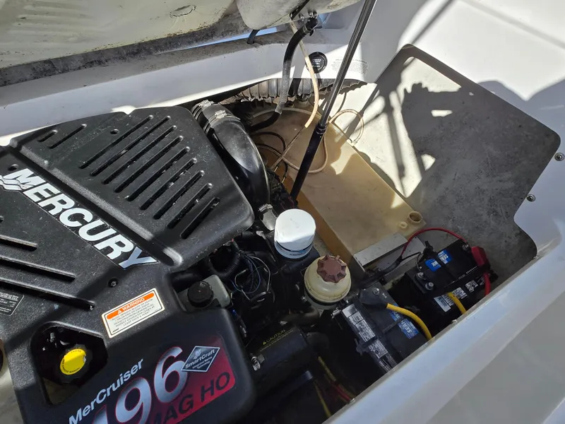 Slide: The Image of Engine compartment of a 2006 Cobalt 262 boat featuring a Mercury MerCruiser 496 MAG HO engine. - 13