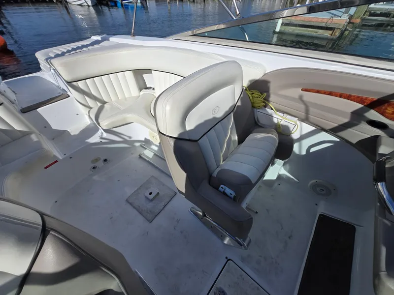 Slide: The Image of Interior of a 2006 Cobalt 262 boat with white leather seating. - 18