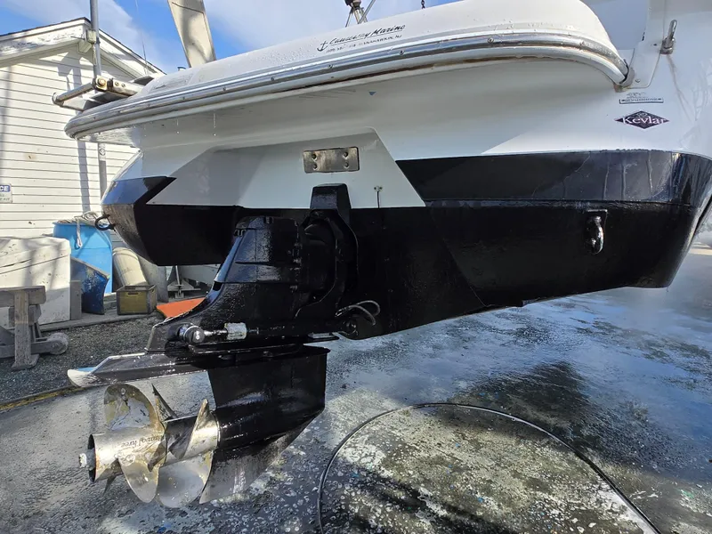 Slide: The Image of 2006 Cobalt 262 boat stern with propeller, docked on a sunny day. - 31