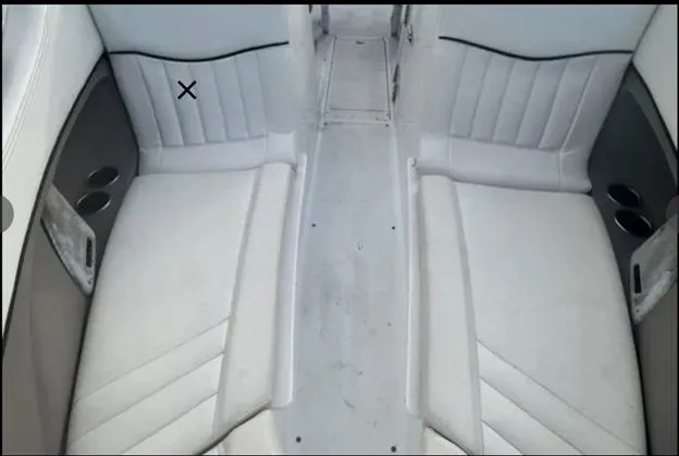 Slide: The Image of 2006 Cobalt 262 boat interior with white seating and cup holders. - 8