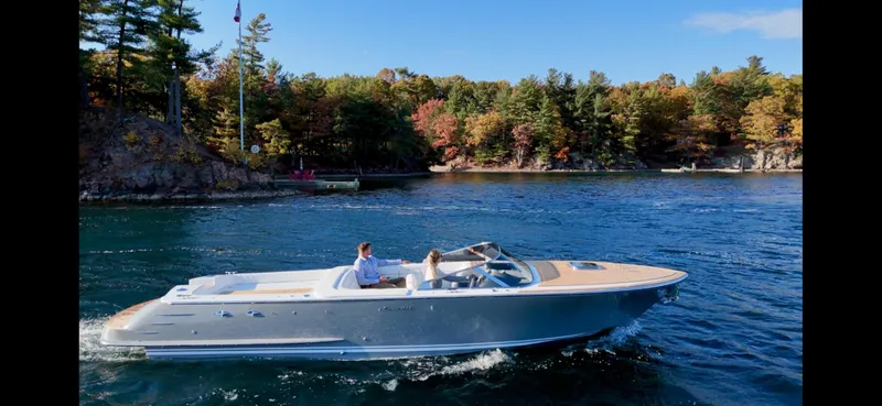 Slide: The Image of 2024 Comitti Venezia V28 cruising on a scenic lake with autumn foliage. - 25
