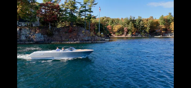 Slide: The Image of 2024 Comitti Venezia V28 cruising on a scenic lake with autumn foliage. - 26