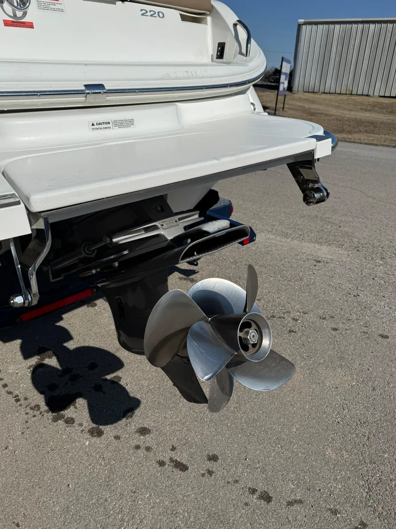 Slide: The Image of Rear view of a 2015 Cobalt 220 boat with propeller and swim platform. - 3