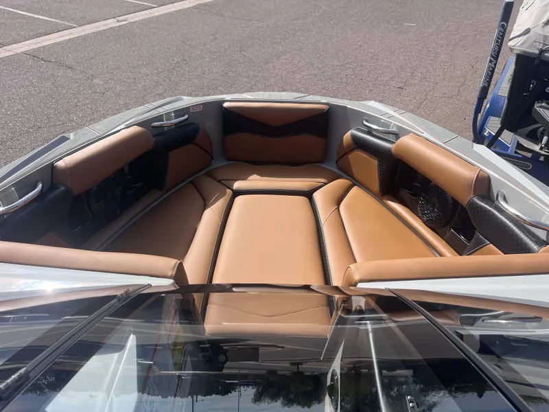 Slide: The Image of Luxurious interior of 2025 Supreme S240 boat with tan leather seating. - 11