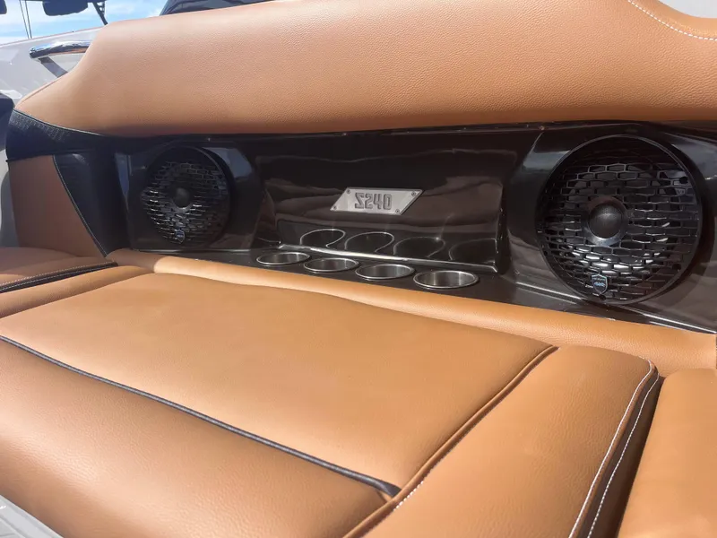 Slide: The Image of Luxurious tan leather seating with speakers in a 2025 Supreme S240 boat interior. - 5
