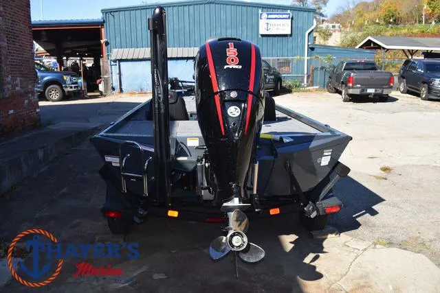 Slide: The Image of 2025 Ranger RT198P boat with 150 Pro motor in a marina setting. - 10