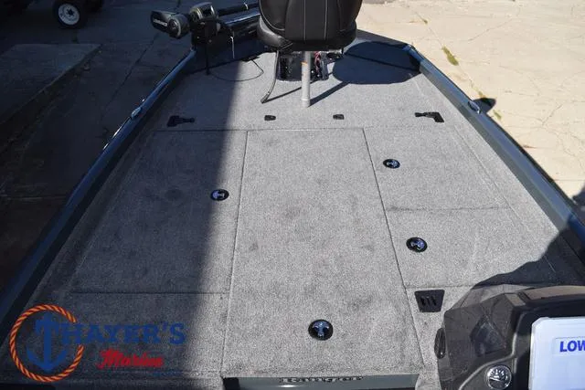 Slide: The Image of 2025 Ranger RT198P boat deck with storage compartments and seating. - 13