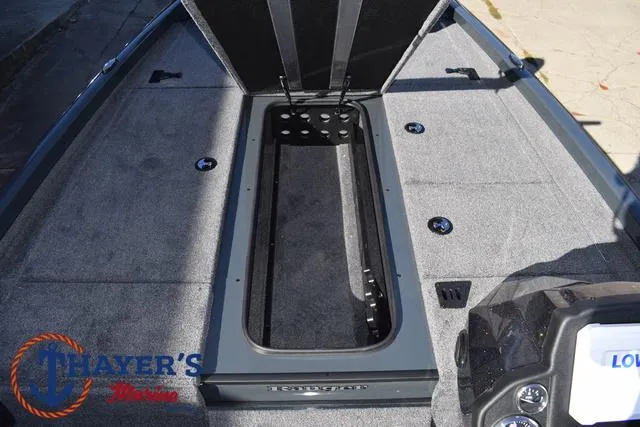 Slide: The Image of 2025 Ranger RT198P boat interior with open storage compartment. - 17
