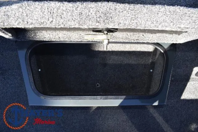 Slide: The Image of Ranger RT198P 2025 boat storage compartment with carpeted interior and secure latch. - 19