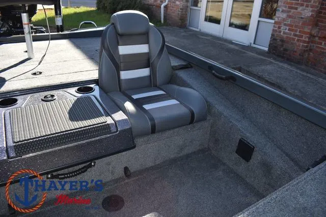 Slide: The Image of 2025 Ranger RT198P boat interior with gray seating and storage compartments. - 21