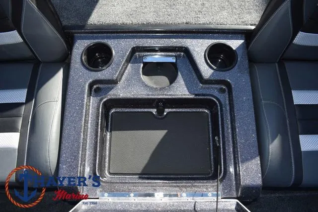 Slide: The Image of 2025 Ranger RT198P boat interior with cup holders and storage compartment. - 23