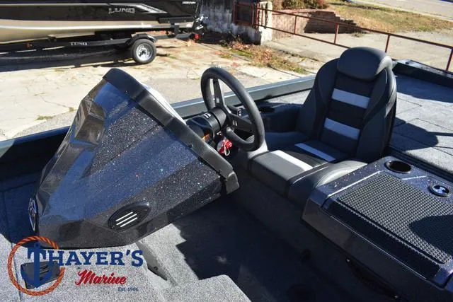 Slide: The Image of 2025 Ranger RT198P boat interior with steering wheel and seating at Thayer's Marine. - 25