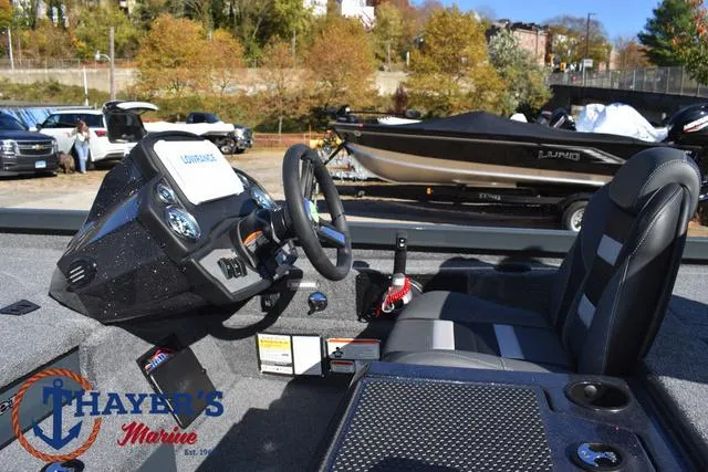 Slide: The Image of 2025 Ranger RT198P boat interior with steering wheel and seating at Thayer's Marine. - 26