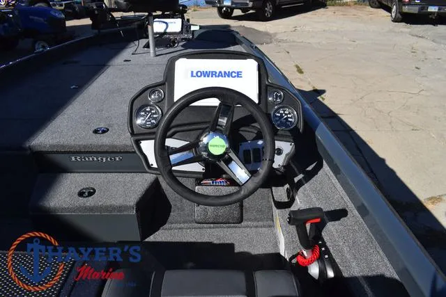 Slide: The Image of 2025 Ranger RT198P boat dashboard with Lowrance electronics and steering wheel. - 27