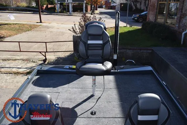 Slide: The Image of 2025 Ranger RT198P fishing boat with seating, parked outdoors. - 28