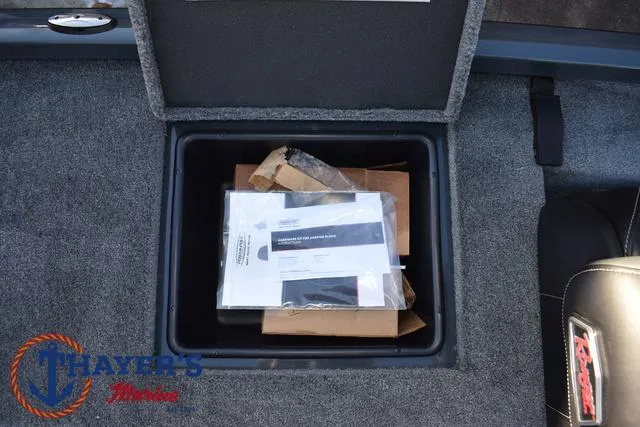 Slide: The Image of Storage compartment in 2025 Ranger RT198P boat with manuals and packaging. - 30