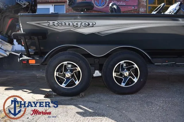 Slide: The Image of 2025 Ranger RT198P boat on trailer at Thayer's Marine dealership. - 6
