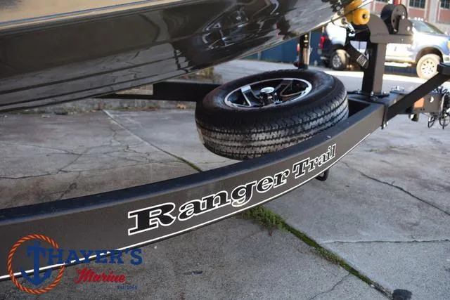 Slide: The Image of 2025 Ranger RT198P boat trailer with spare tire, featuring Ranger Trail branding. - 7