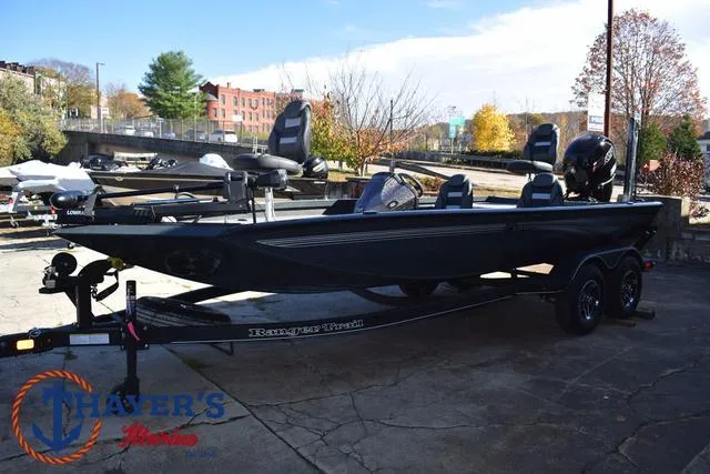 Slide: The Image of 2025 Ranger RT198P fishing boat on trailer in outdoor setting. - 8