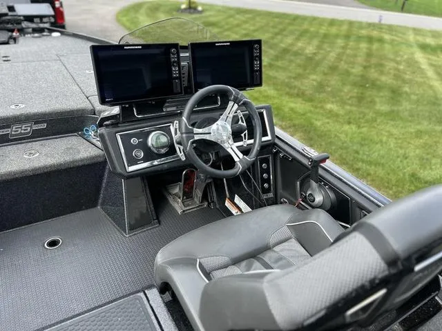 Slide: The Image of 2023 Ranger Z520R boat cockpit with dual screens and steering wheel. - 13