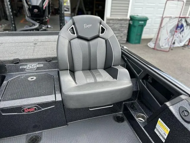 Slide: The Image of 2023 Ranger Z520R boat seat, gray and black design, in a garage setting. - 15