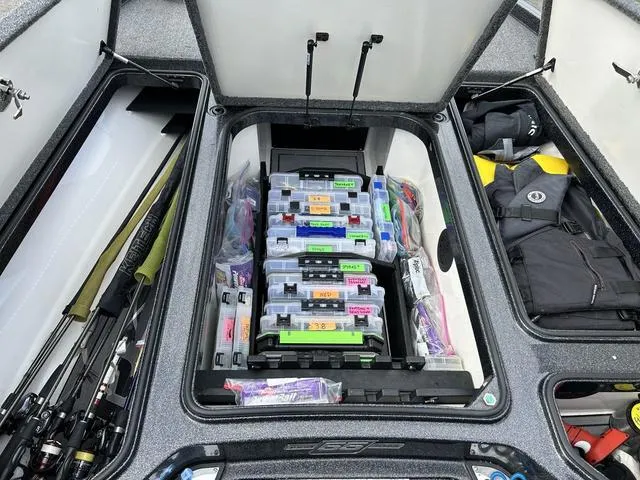 Slide: The Image of 2023 Ranger Z520R boat storage with organized fishing gear and tackle boxes. - 17
