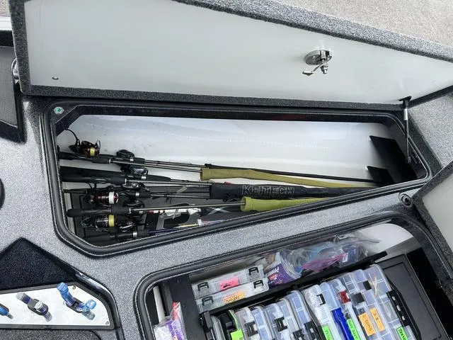 Slide: The Image of 2023 Ranger Z520R fishing boat storage with rods and tackle boxes. - 18