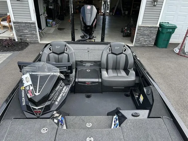 Slide: The Image of 2023 Ranger Z520R fishing boat with dual seats and motor in driveway. - 20