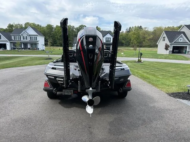 Slide: The Image of 2023 Ranger Z520R boat parked in suburban driveway, rear view. - 23