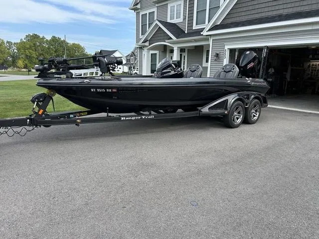 Slide: The Image of 2023 Ranger Z520R boat on trailer parked in driveway. - 25