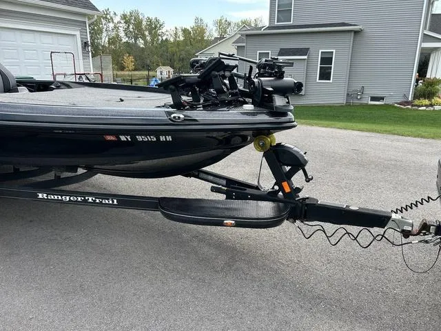 Slide: The Image of 2023 Ranger Z520R boat on trailer in residential driveway. - 26