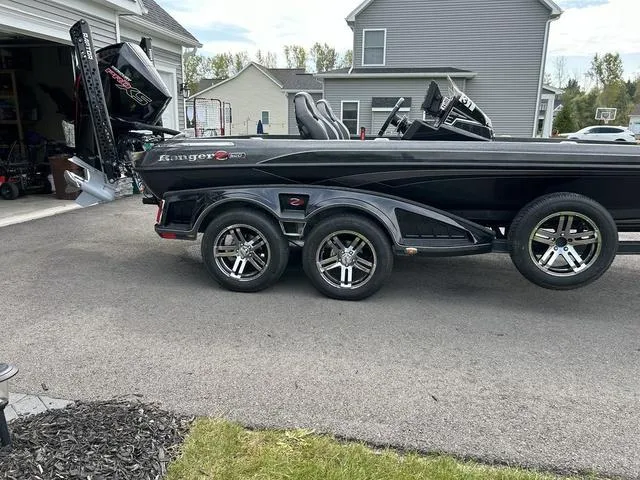 Slide: The Image of 2023 Ranger Z520R boat on trailer parked in driveway. - 28