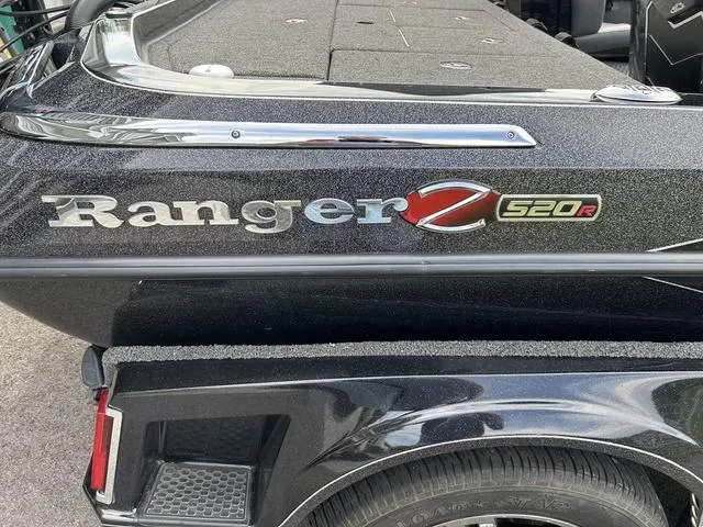 Slide: The Image of 2023 Ranger Z520R boat, black exterior with logo detail. - 29