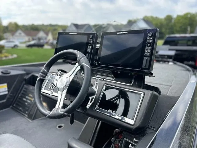 Slide: The Image of 2023 Ranger Z520R boat dashboard with dual Humminbird displays and steering wheel. - 3