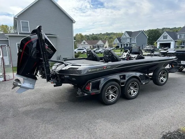 Slide: The Image of 2023 Ranger Z520R boat on trailer in suburban neighborhood driveway. - 30