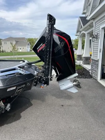 Slide: The Image of 2023 Ranger Z520R boat with powerful outboard motor parked in driveway. - 5