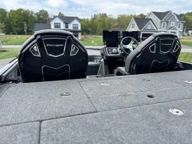 Slide: The Image of 2023 Ranger Z520R boat interior with dual seats and modern dashboard. - 7