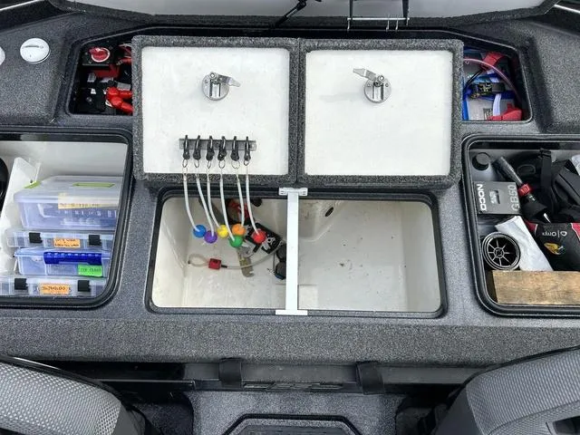 Slide: The Image of 2023 Ranger Z520R boat storage compartments with organized fishing gear and accessories. - 8