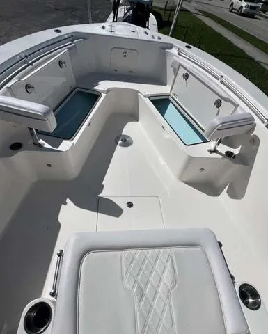 Slide: The Image of 2025 Sea Born LX 26 XSF boat interior with seating and storage compartments. - 3