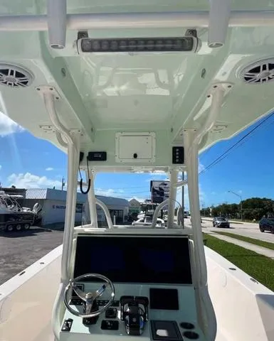 Slide: The Image of 2025 Sea Born LX 26 XSF boat interior with modern helm and controls. - 7