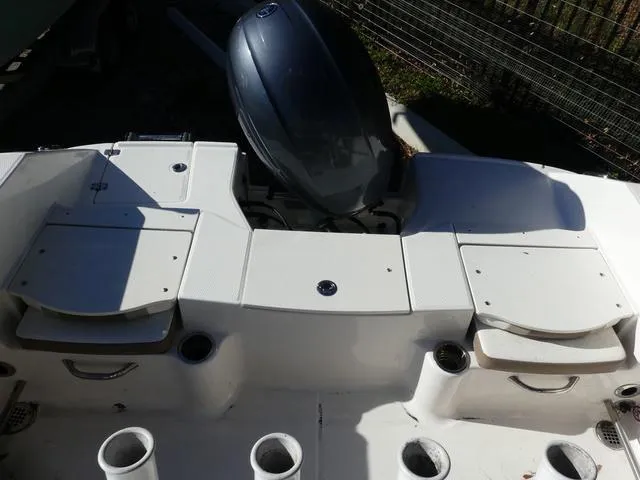 Slide: The Image of 2023 Robalo R200 boat stern with engine and storage compartments. - 14