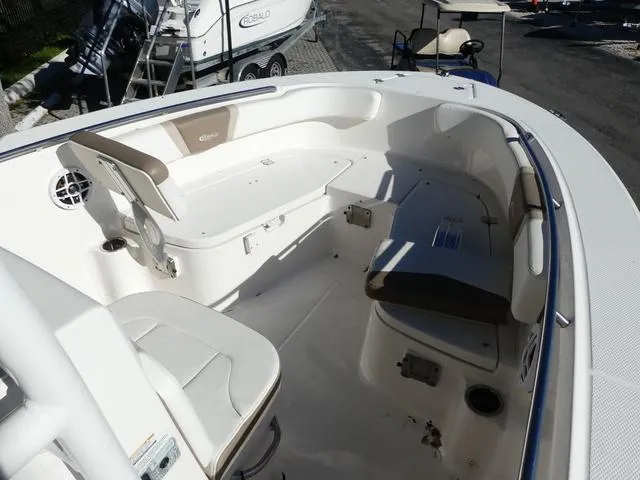 Slide: The Image of 2023 Robalo R200 boat interior with cushioned seating and storage compartments. - 15